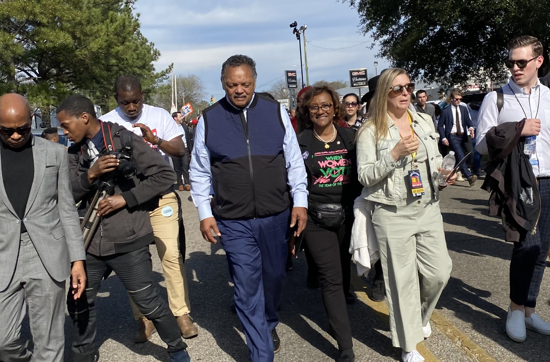 Dr. Karen Bennett walking alongside Rev. Jesse Jackson during a voting rights march